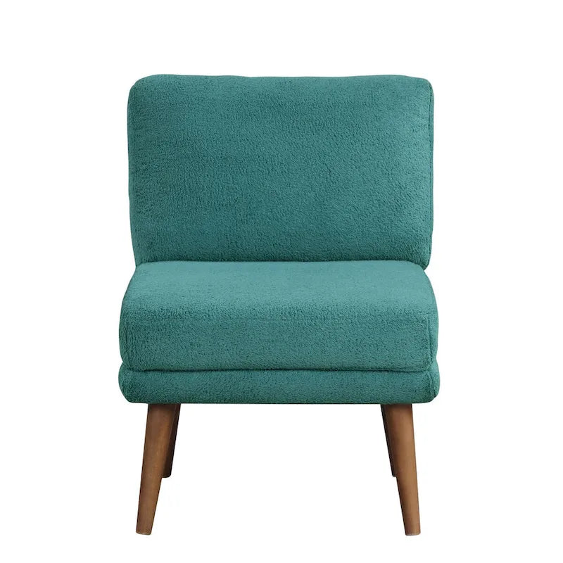 Sillón decorativo verde azulado con respaldo capitoné