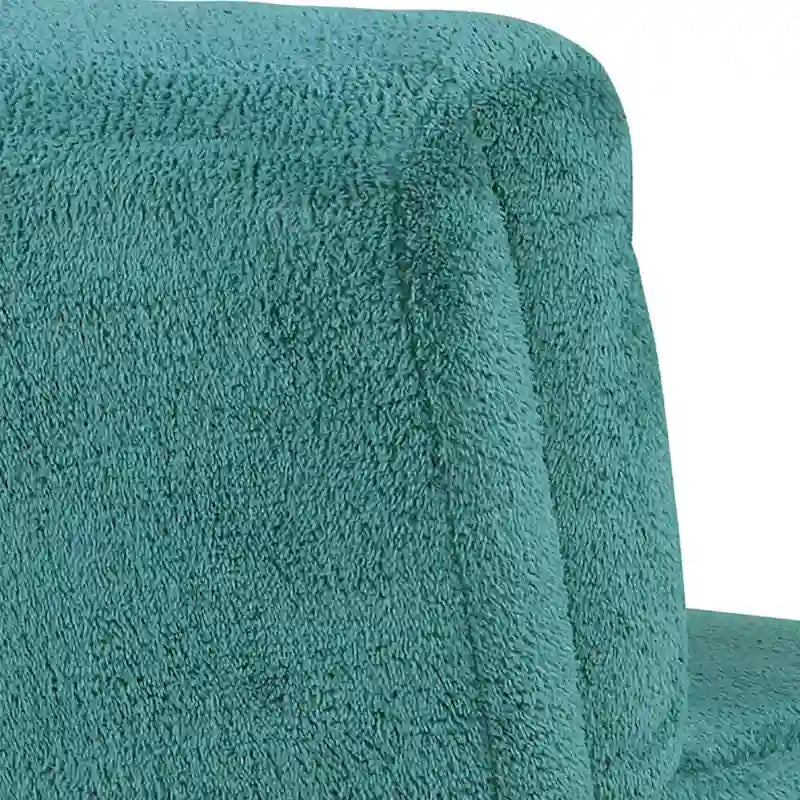 Sillón decorativo verde azulado con respaldo capitoné